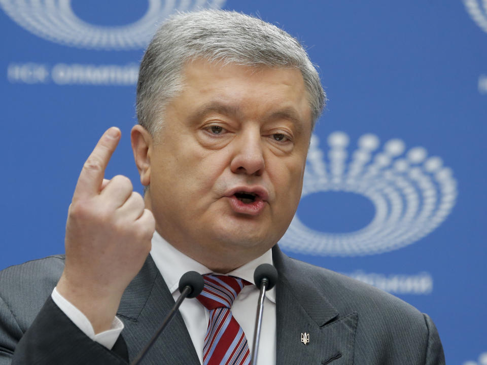 Ukrainian President Petro Poroshenko gestures as he answers to a journalist's question ahead of the presidential elections on April 21, at the Olympic stadium in Kiev, Ukraine, Sunday, April 14, 2019. With one week remaining until Ukraine's presidential election, incumbent Petro Poroshenko has come to the country's largest stadium for a proposed debate where his opponent didn't show up. (AP Photo/Efrem Lukatsky)