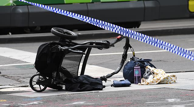 A pram lies on its side inside the area of Bourke Street cordoned off by police. Photo: AAP