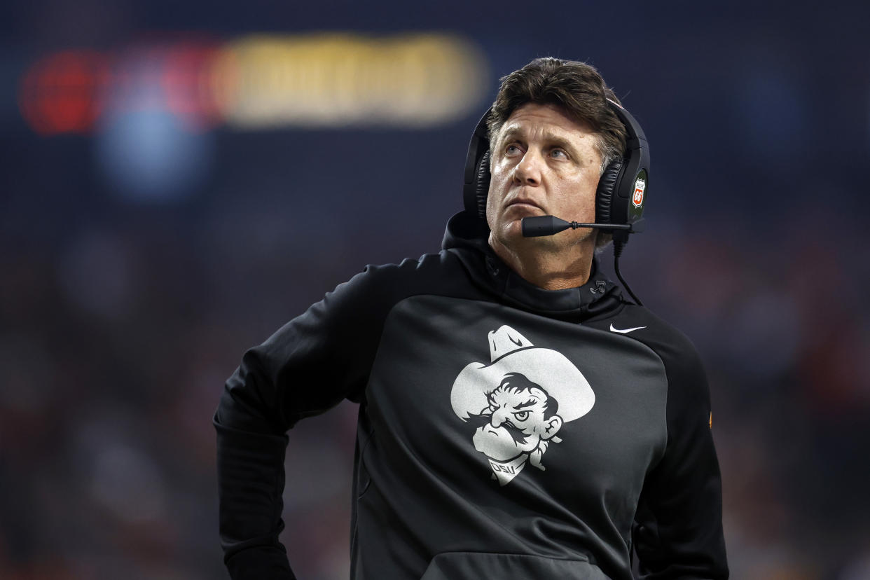 PHOENIX, ARIZONA - DECEMBER 27: Head coach Mike Gundy of the Oklahoma State Cowboys looks on during the first half of the Guaranteed Rate Bowl against the Wisconsin Badgers at Chase Field on December 27, 2022 in Phoenix, Arizona. (Photo by Chris Coduto/Getty Images)