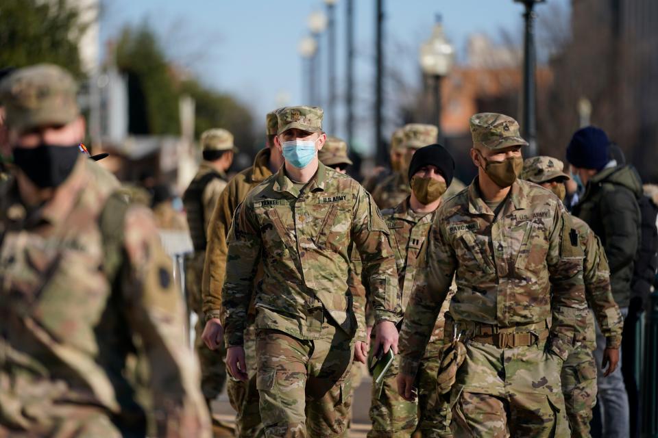 DC National Guard walk around the Capitol grounds, Jan. 7, 2021 in Washington. 