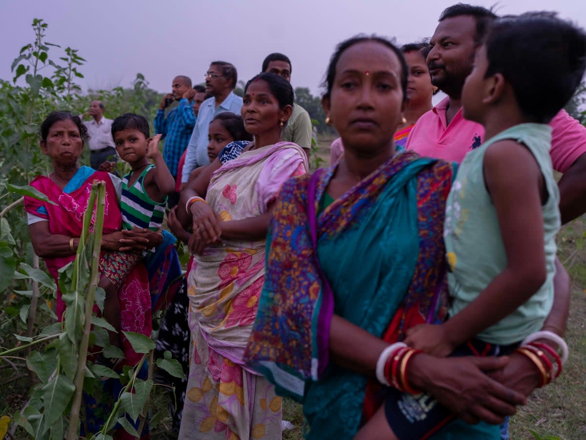 Locals in Odisha state at the site of the crash on Sunday (AP)