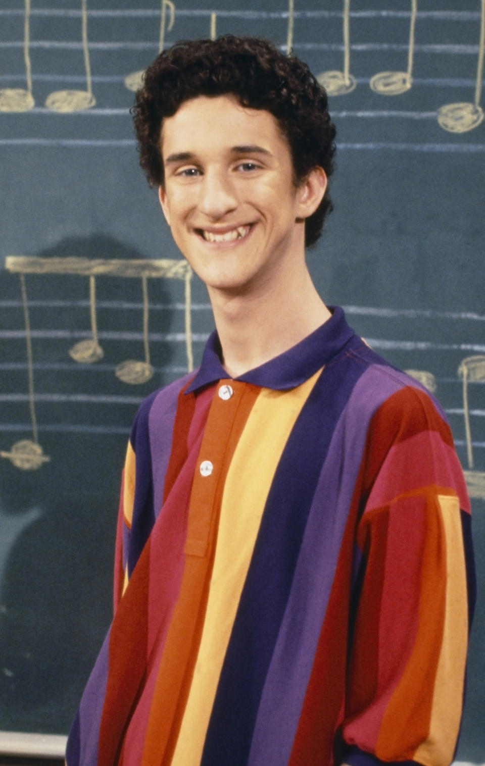 This image released by NBC shows actor Dustin Diamond as Samuel Powers, better known as Screech" from the 1990's series "Saved by the Bell." Diamond died Monday after a three-week fight with carcinoma, according to his representative. He was 44. Diamond was hospitalized last month in Florida and his team disclosed later he had cancer. (Paul Drinkwater/NBCU Photo Bank via AP)
