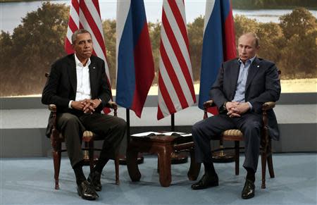 U.S. President Barack Obama (L) meets with Russian President Vladimir Putin during the G8 Summit at Lough Erne in Enniskillen, Northern Ireland, in this June 17, 2013 file photo. REUTERS/Kevin Lamarque/Files