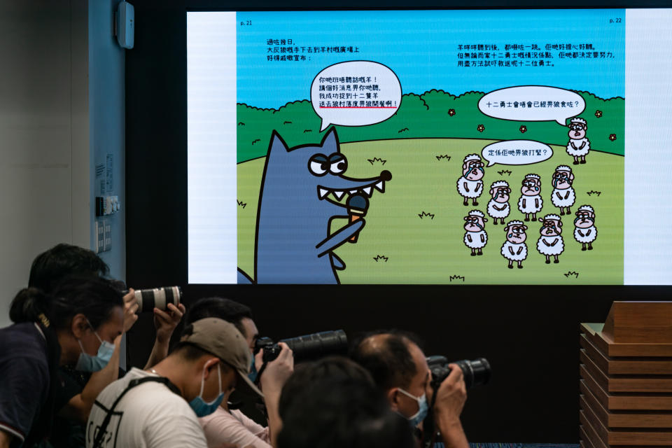 HONG KONG, CHINA - JULY 22: Content of children's books are displayed on a TV screen during a press conference after five people were arrested under suspicion of conspiring to publish seditious material at the Hong Kong Police Headquarters on July 22, 2021 in Hong Kong, China. National Security  Department of Hong Kong Police Force arrested five members of the General Union of Hong Kong Speech Therapists over three children's books featuring sheep that are suspected of inciting hatred towards the Hong Kong SAR government. (Photo by Anthony Kwan/Getty Images)