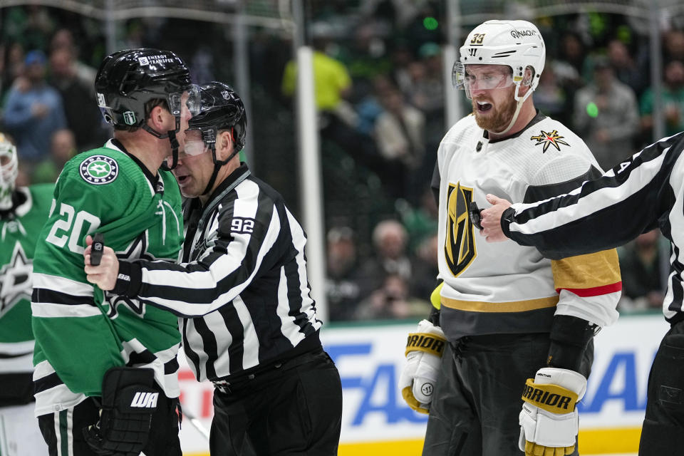Dallas Stars defenseman Ryan Suter (20) and Vegas Golden Knights right wing Anthony Mantha (39) exchange words after a scuffle during the second period in Game 2 of an NHL hockey Stanley Cup first-round playoff series in Dallas, Wednesday, April 24, 2024. (AP Photo/Tony Gutierrez)