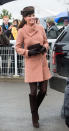 <p>Kate wrapped up at the Cheltenham Festival in a nude coat by Joseph. The Duchess teamed the look with a brown Lock & Co hat and knee high Stuart Weitzman boots. </p><p><i>[Photo: PA]</i></p>