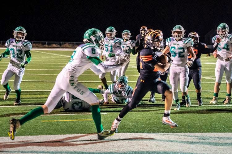 Taos' Mateo Salazar scores a touchdown against Moriarty during a game, Friday, Oct. 28, 2022.