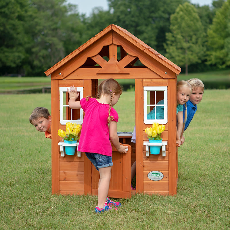 This sturdy wood playhouse is $60 off! (Photo: Walmart)