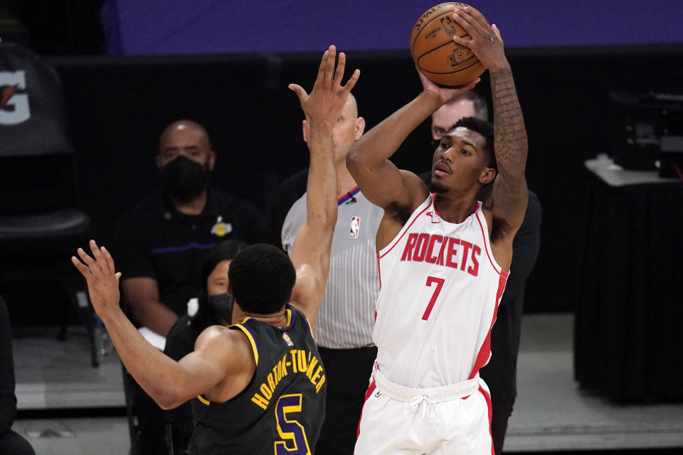 Houston Rockets guard Armoni Brooks, right, shoots as Los Angeles Lakers guard Talen Horton-Tucker defends during the second half of an NBA basketball game Wednesday, May 12, 2021, in Los Angeles. (AP Photo/Mark J. Terrill)