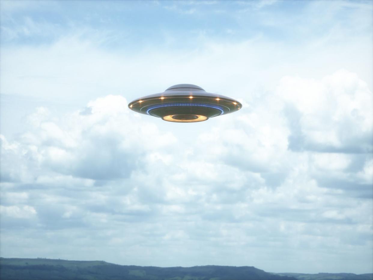 Unidentified flying object. UFO with clipping path included. 3D illustration in real picture.