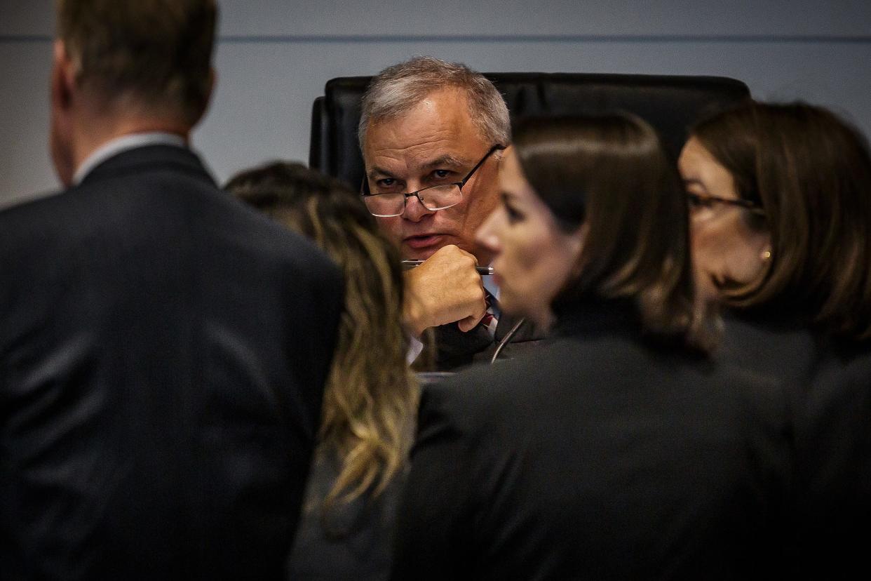 Judge Howard K. Coates Jr. listens to attorneys at a bench conference during jury selection in the aggravated child abuse trial of Timothy Ferriter, of Jupiter, at the Palm Beach County Courthouse in downtown West Palm Beach, Fla., on September 29, 2023.