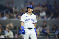 Toronto Blue Jays' Daulton Varsho reacts after striking out during the eighth inning of the team's baseball game against the Chicago White Sox on Tuesday, May 21, 2024, in Toronto. (Christopher Katsarov/The Canadian Press via AP)