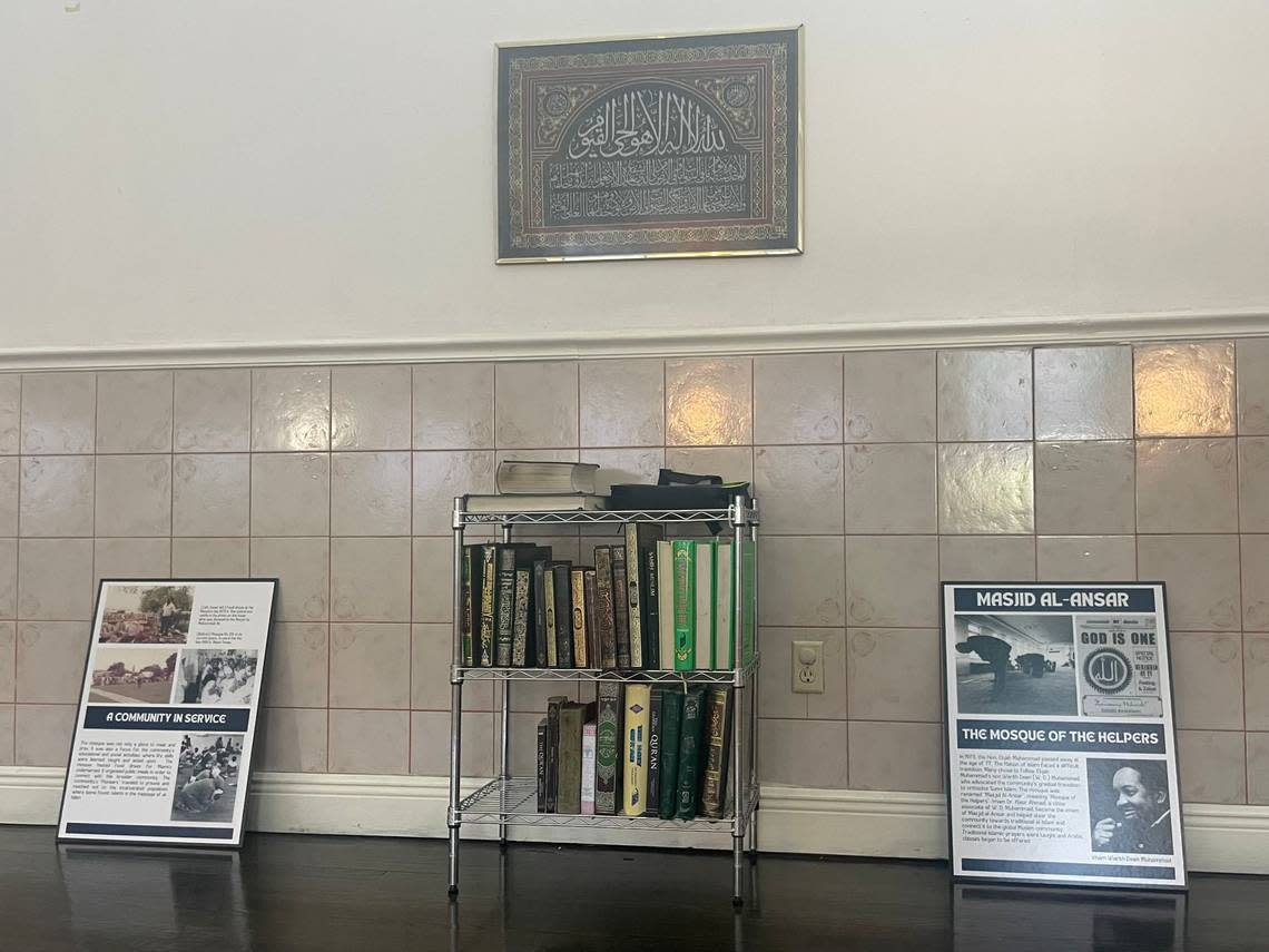 A bookshelf and two posters about the mosque are on display at Masjid Al-Ansar during the Ramadan open house on Thursday, April 6, 2023. Masjid Al-Ansar is the oldest mosque in Florida.