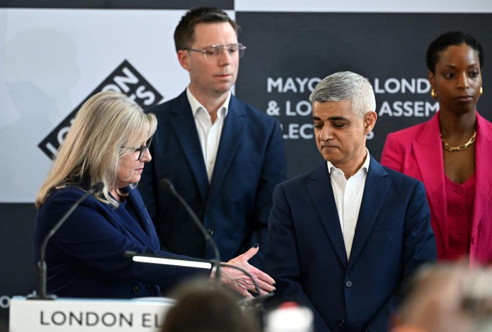 Susan Hall extends a handshake to Sadiq Khan as he is announced Mayor of London for a third time (Getty Images)