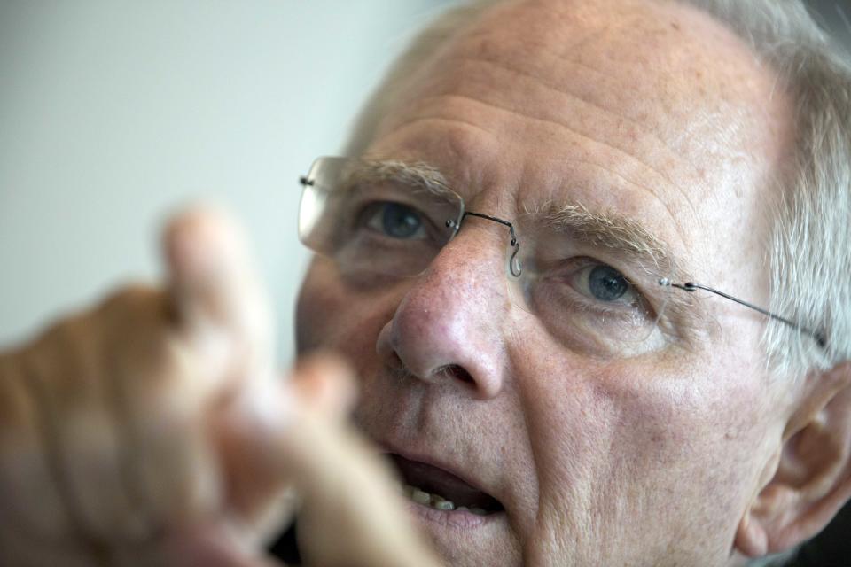 German Finance Minister Wolfgang Schaeuble gestures before a meeting of the CDU/CSU parliamentary parties prior to a special session of the Germany Parliament Bundestag in Berlin, Germany, Thursday, July 19, 2012. Germany's Parliament is interrupting its summer break to vote on a rescue package worth up to euro 100 billion (US dollar122 billion) for Spain's ailing banks. (AP Photo/Gero Breloer)