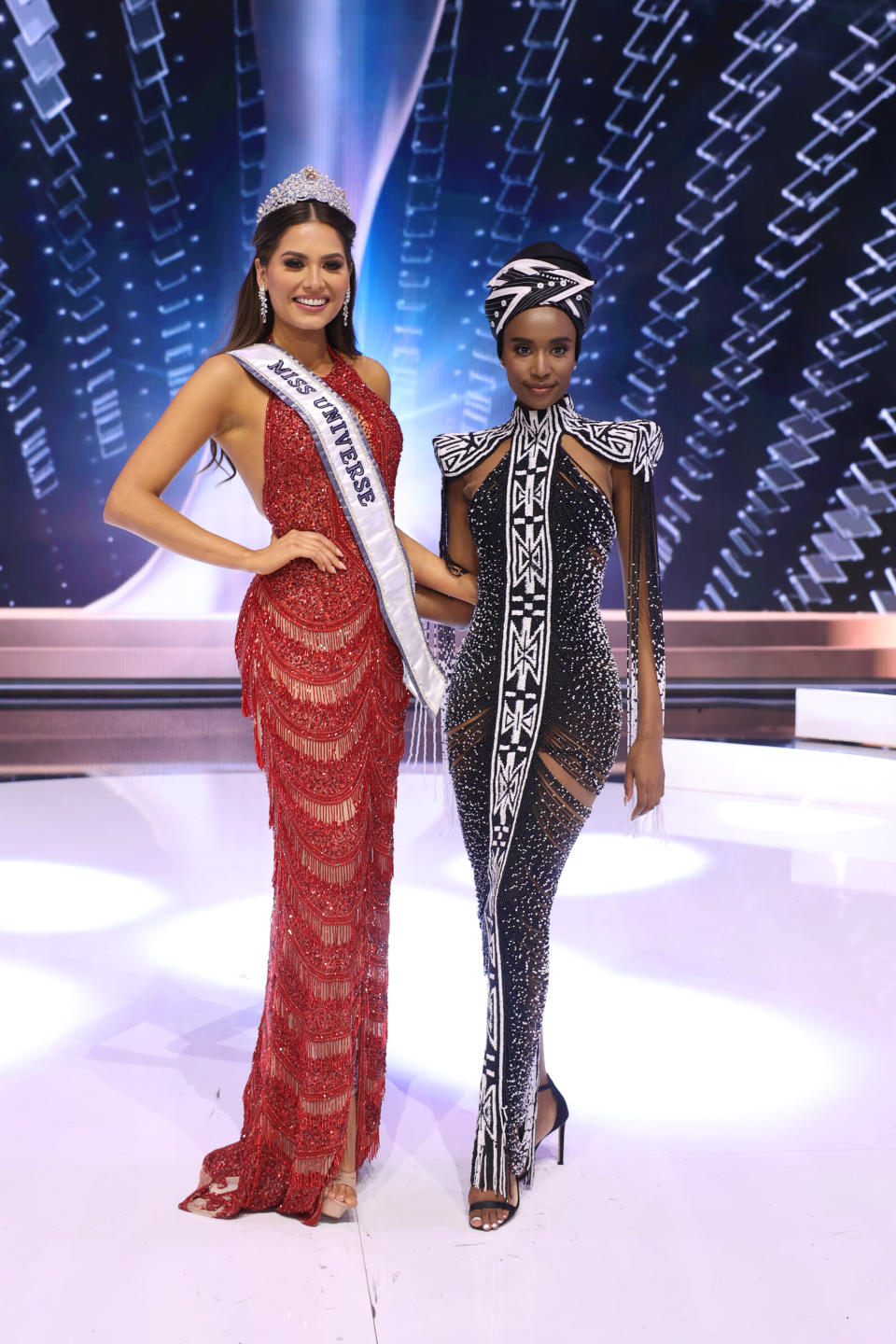 HOLLYWOOD, FLORIDA - MAY 16: Miss Universe 2020 Andrea Meza and Miss Universe 2019 Zozibini Tunzi pose onstage at the 69th Miss Universe competition at Seminole Hard Rock Hotel & Casino on May 16, 2021 in Hollywood, Florida. (Photo by Rodrigo Varela/Getty Images)