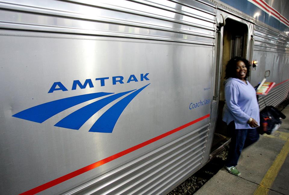A passenger disembarks from Amtrak's Sunset Limited at its final stop in New Orleans, Nov. 2, 2008.