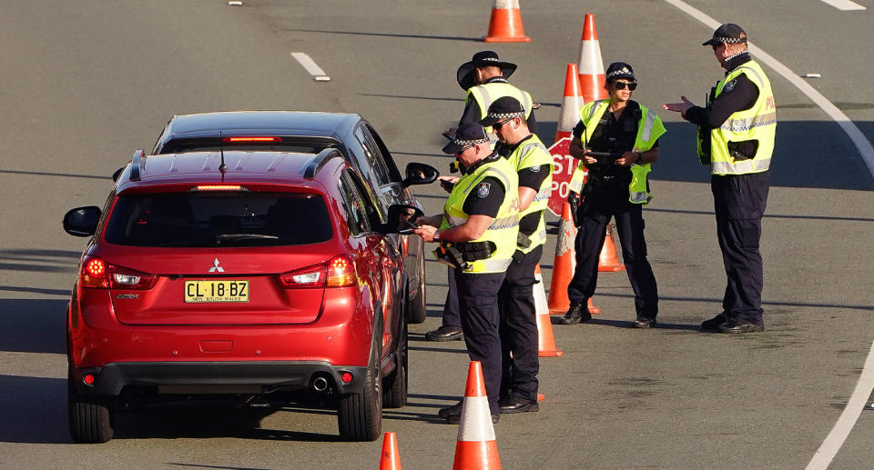 Queensland Police carrying out border checks on cars entering the state. Source: Getty