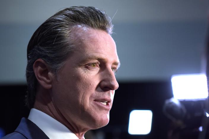 California Governor Gavin Newsom speaks to the press in the spin room after the sixth Democratic primary debate of the 2020 presidential campaign season co-hosted by PBS NewsHour &amp; Politico at Loyola Marymount University in Los Angeles, California on December 19, 2019. (Photo by Agustin PAULLIER / AFP) (Photo by AGUSTIN PAULLIER/AFP via Getty Images) ORIG FILE ID: AFP_1N77A8