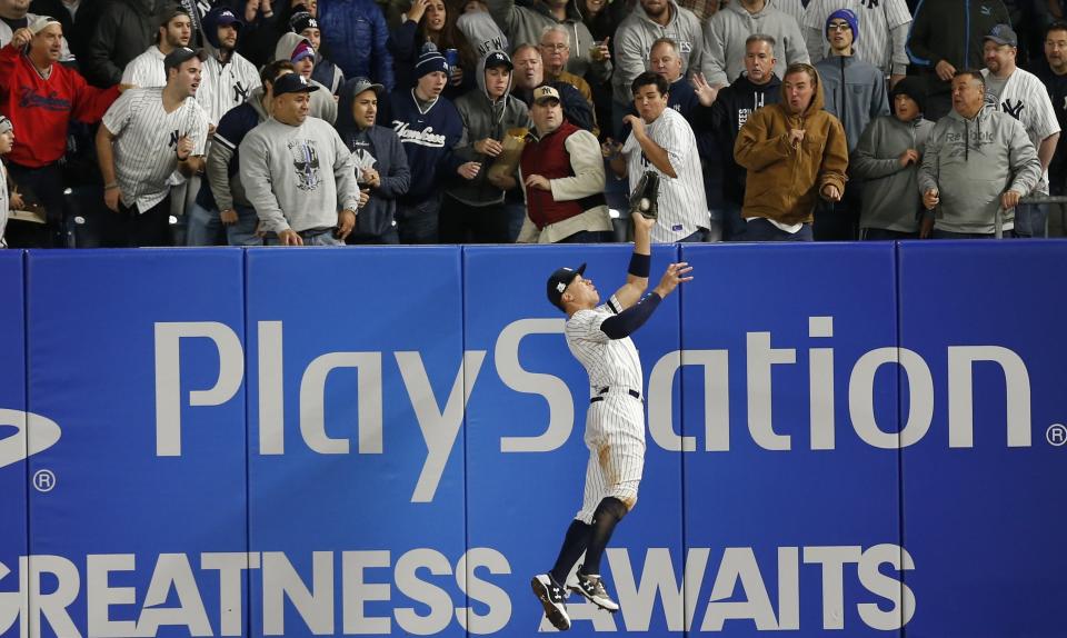 New York Yankees’ Aaron Judge makes a leaping catch of a ball hit by Houston Astros’ Yuli Gurriel during the fourth inning of Game 3 of baseball’s American League Championship Series Monday, Oct. 16, 2017, in New York. (AP)