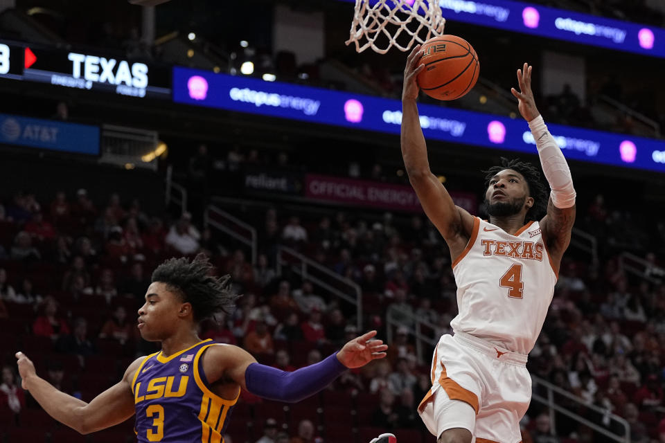 Texas guard Tyrese Hunter (4) scores during the first half of an NCAA college basketball game against LSU, Saturday, Dec. 16, 2023, in Houston. (AP Photo/Kevin M. Cox)