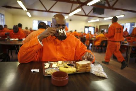 Prison inmate Michael Perkins, 51, eats breakfast at Oak Glen Conservation Fire Camp #35 in Yucaipa, California November 6, 2014. REUTERS/Lucy Nicholson