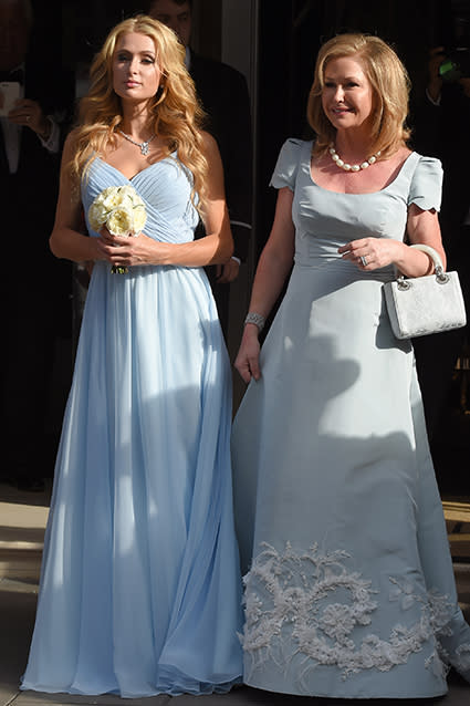 Nicky Hilton is officially a married woman! The 31-year-old socialite married James Rothschild, an heir to one of Europe's greatest banking families, at Kensington Palace in London on Friday evening. Nicky looked gorgeous, wearing a lacy long-sleeved Valentino lace wedding gown. FameFlynet FameFlynet <strong>WATCH: Ed Sheeran Surprises Couples and Becomes the Best Wedding Singer of All Time</strong> FameFlynet Nicky's older sister, Paris Hilton, served as a bridesmaid in a soft powder blue dress, while proud parents, Richard and Kathy, were on hand. Aunt Kyle Richards was also there to see her niece walk down the aisle. Splash News Celebrity wedding guests included supermodel Naomi Campbell, Chelsea Clinton and her husband, Marc Mezvinsky, and billionaire Formula One heiress Petra Stunt -- it was actually at Petra's 2011 wedding to James Stunt where the couple met. As for post-nuptial entertainment, the couple will be serenaded by none other than Lionel Richie. Check out Nicky's walk down the aisle. Prior to the big day, Nicky and James held a pre-wedding dinner on Thursday night at Spencer House in St. James's for close friends and family. Check out this super-cute snap of the couple smooching before the ceremony. "So happy that my sister found the man of her dreams," Paris Instagrammed. "They make the perfect couple! So excited for their wedding today! #MrsRothschild." Friday's nuptials marks Nicky's second marriage. Nicky married businessman Todd Meister in Las Vegas in August 2004, but it was annulled just three months later. She's been engaged to James since August 2014, and they've been dating since 2011. <strong>WATCH: Ashton Kutcher and Mila Kunis Wed in Secret Ceremony</strong> Check out 9 celebrity weddings we can't wait for in the video below!