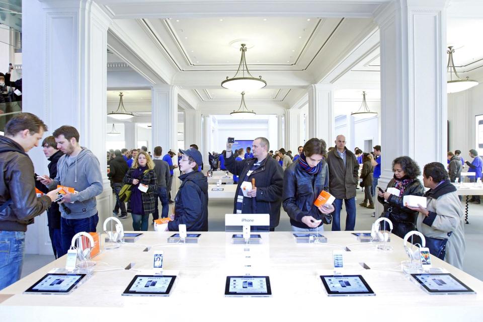 The first Apple Store in the Netherlands opens its doors in Amsterdam, on March 4, 2012. Hours before the opening there was already a long line of Apple fans waiting to shop on the Leidseplein: ADE JOHNSON/AFP/Getty Images