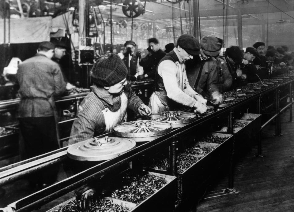 1914: Flywheel production at the Ford motor plant in Highland Park, Michigan.