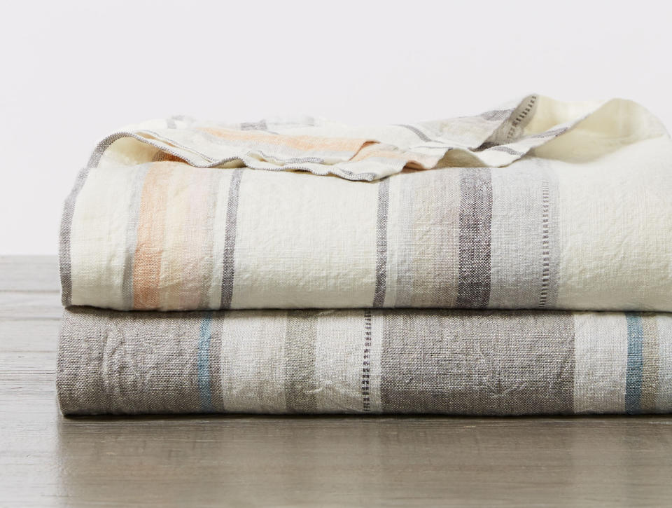 This photo provided by Coyuchi shows their Mojave blankets. If you prefer a lightweight blanket, consider Coyuchi's collections. Made of washed organic Turkish cotton, the blankets are lovely and lofty, perfect for hot sleepers. Choose from pleasing neutral colors like Riverstone, Midnight Blue, Alpine White and Blush. (Coyuchi via AP)