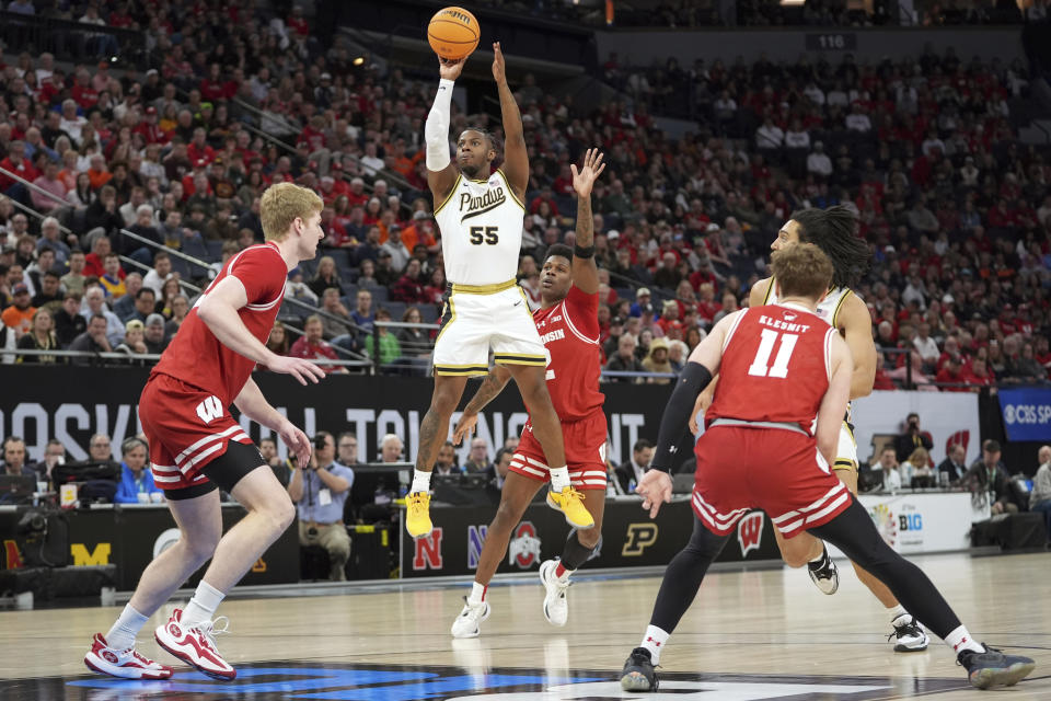 Purdue guard Lance Jones (55) shoots during the first half of an NCAA college basketball game against Wisconsin in the semifinal round of the Big Ten Conference tournament, Saturday, March 16, 2024, in Minneapolis. (AP Photo/Abbie Parr)