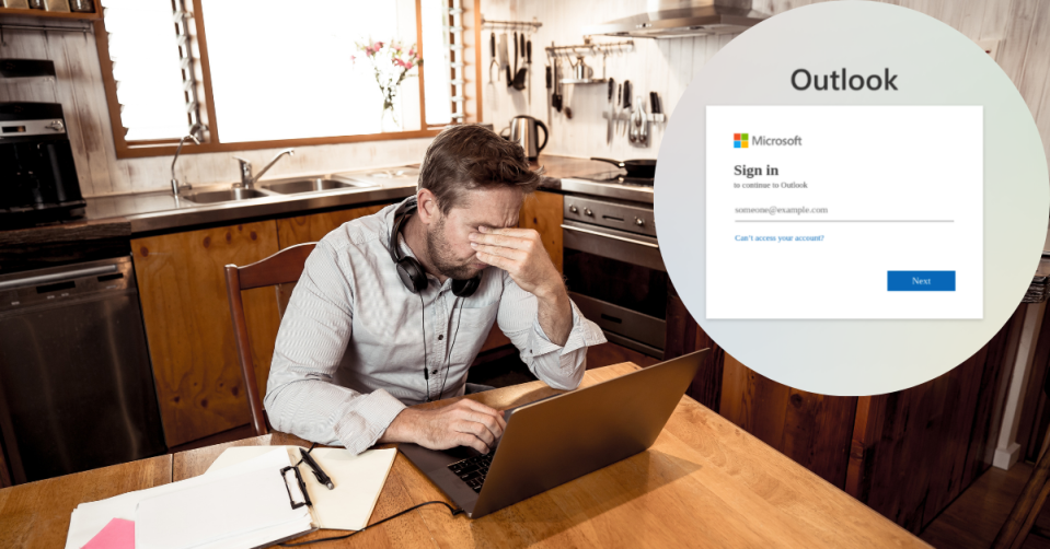 Man on laptop looks stressed with Microsoft outlook scam page in the corner