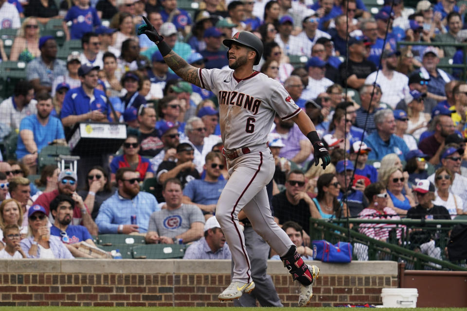 Arizona Diamondbacks' David Peralta celebrates his solo home run during the third inning of a baseball game against the Chicago Cubs in Chicago, Friday, May 20, 2022. (AP Photo/Nam Y. Huh)