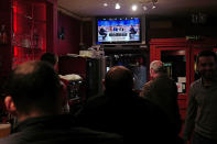 <p>People watch a live broadcast television debate with French centrist presidential candidate Emmanuel Macron, right, and far-right candidate Marine Le Pen, in a restaurant in Lille, northern France, Wednesday, May 3, 2017. Le Pen and Emmanuel Macron exchanged barbs and insults on Wednesday during their sole televised debate ahead of Sunday’s runoff election. (AP Photo/Michel Spingler) </p>