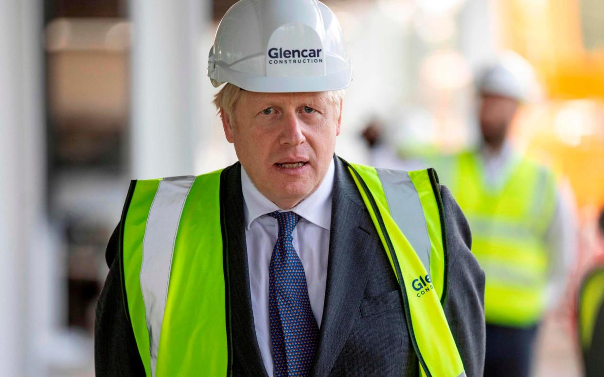 Britain's Prime Minister Boris Johnson visits the construction site of the new dedicated Vaccines Manufacturing Innovation Centre (VMIC) currently under construction on the Harwell science and innovations campus near Didcot in central England on September 18, 2020 - Richard Pohle/AFP