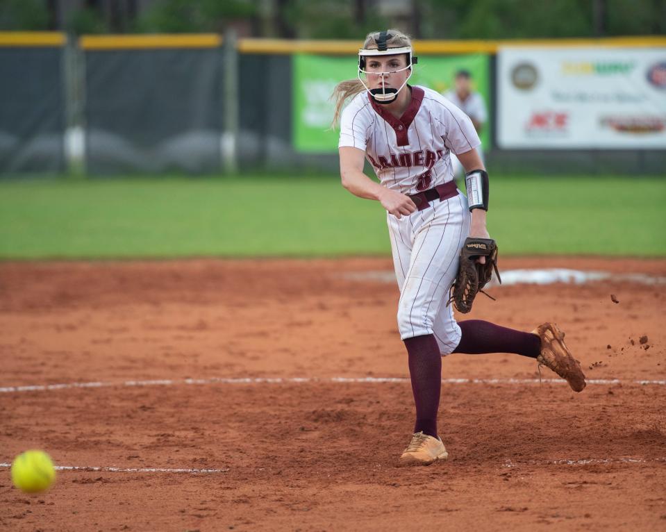 Jessica Farrer (8) pitches during the Gulf Breeze vs Navarre softball game at Navarre High School on Tuesday, April 26, 2022.