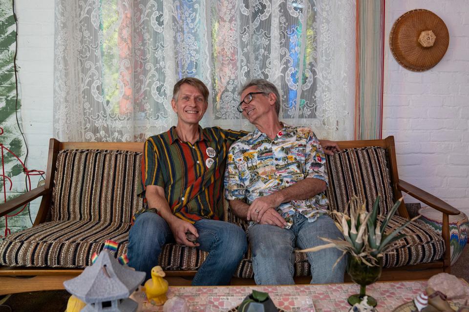 Tracy, 57, and Tim Brown-Salsman, 59, residents of Loogootee, Indiana, pose for a portrait at home Thursday, July 14, 2022. The married couple has lived in Loogootee, Tim's hometown of about 2,500 people, since 1997. The couple is now working to organize the town's first ever pride festival.