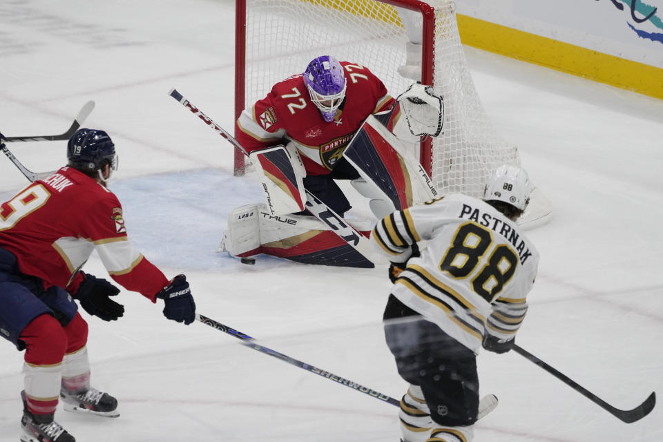 Florida Panthers goaltender Sergei Bobrovsky (72) stops a shot by Boston Bruins right wing David Pastrnak (88) during the first period of an NHL hockey game, Wednesday, Nov. 22, 2023, in Sunrise, Fla. (AP Photo/Marta Lavandier)