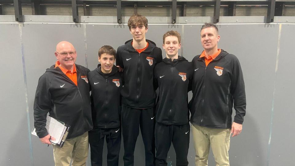 Jonesville coaches Jeff Turner (left) and Jason Elder (right) stand with the Comets' three first team all-conference honorees (from left to right) Caleb Blonde, Gavin Van Kampen and Warrick Elder. Elder was named to the conference dream team. (Original copies available)