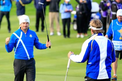 AUCHTERARDER, SCOTLAND - SEPTEMBER 26: Graeme McDowell (L) of Europe celebrates victory with Victor Dubuisson of Europe on the 16th green during the Afternoon Foursomes of the 2014 Ryder Cup on the PGA Centenary course at the Gleneagles Hotel on September 26, 2014 in Auchterarder, Scotland. (Photo by Harry How/Getty Images)