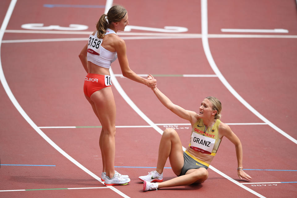 <p>Martyna Galant of Team Poland helps up Caterina Granz of Team Germany after competing in round one of the Women's 1500m heats on day ten of the Tokyo 2020 Olympic Games at Olympic Stadium on August 02, 2021 in Tokyo, Japan. (Photo by Matthias Hangst/Getty Images)</p> 