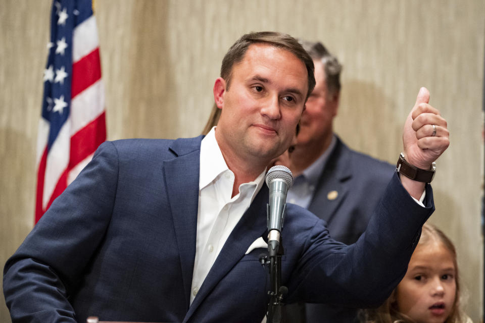 Jason Miyares, Republican candidate for state attorney general, gives a thumbs-up after finishing his speech Tuesday night, Nov. 2, 2021, in Virginia Beach, Va. (Mike Caudill/The Virginian-Pilot via AP)