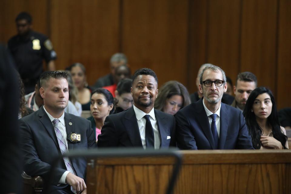 Cuba Gooding Jr., center, appears in court to face new sexual misconduct charges, Tuesday, Oct. 15, 2019, in New York. The new charge involves an alleged incident in October 2018. Gooding Jr. pleaded not guilty. The defense paints it as a shakedown attempt. (Alec Tabak/New York Daily News Pool via AP)