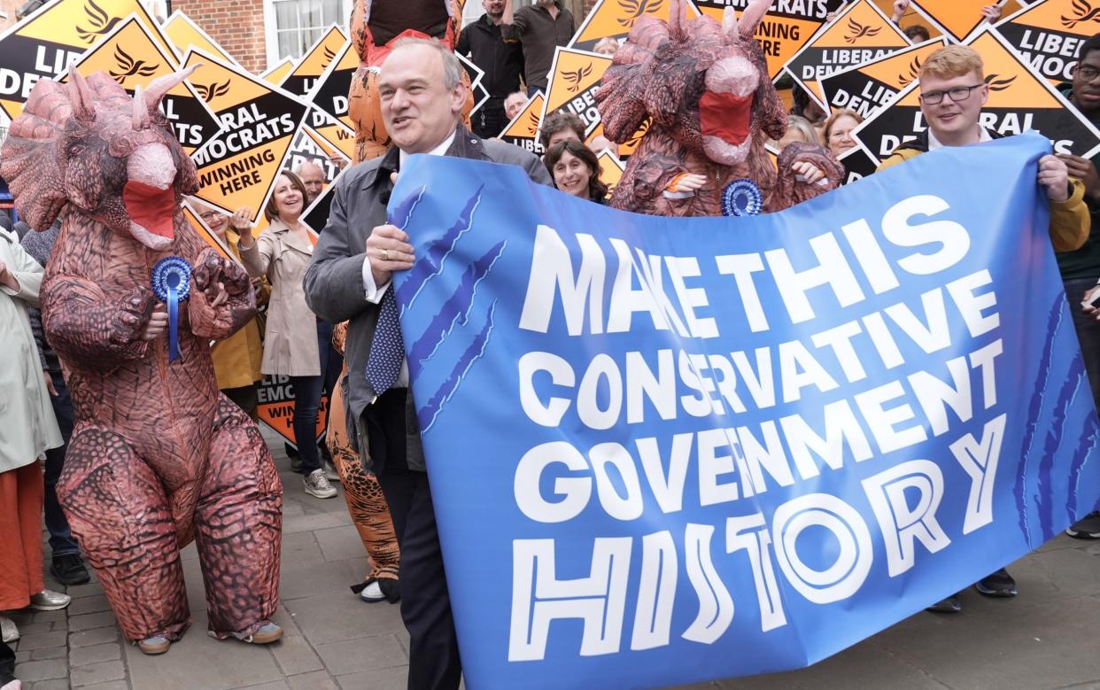 Sir Ed Davey was greeted by Tory 'dinosaurs' at a  celebratory Lib Dem rally in Winchester