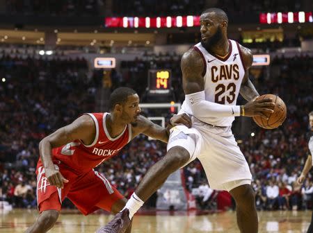 Nov 9, 2017; Houston, TX, USA; Cleveland Cavaliers forward LeBron James (23) dribbles the ball as Houston Rockets forward Trevor Ariza (1) defends during the fourth quarter at Toyota Center. Mandatory Credit: Troy Taormina-USA TODAY Sports