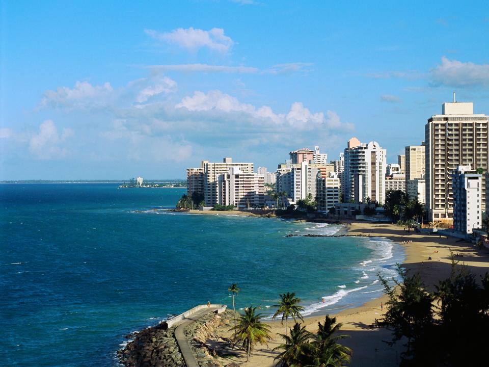 Tall buildings line Condado Beach in San Juan, Puerto Rico.