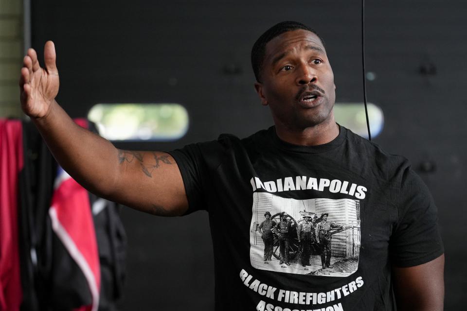 Corey Floyd, president of the Indianapolis Back Firefighters Association, shows off the beginnings of a visual history display that will highlight how Black firefighters helped shape the city's department Friday, Sept. 1, 2023, at old Station 31 on E. 46th Street. Floyd grew up just down the street and as a child, would walk over from playing baseball at the neighboring fairgrounds for cookouts at Station 31. He sees the project as one way to give back to the community that gave to him, and is passionate about increasing diversity in firefighting.