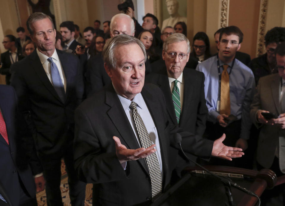 FILE – In this March 6, 2018, file photo, Sen. Mike Crapo, R-Idaho, chairman of the Senate Banking Committee, joined by, Sen. John Thune, R-S.D., left, and Senate Majority Leader Mitch McConnell, R-Ky., right, talks to reporters as the Senate moves closer to passing legislation to roll back some of the safeguards Congress put in place to prevent a repeat of the 2008 financial crisis, at the Capitol in Washington. Burrowed within new Senate legislation to roll back restraints on banks is a break from data reporting requirements for lenders making certain levels of mortgage loans. (AP Photo/J. Scott Applewhite, File)