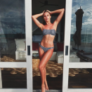 <p>The model poses in a gingham print bikini, her resemblance to Jen Hawkins in uncanny.</p>