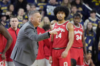 Ohio State head coach Chris Holtmann talks to his team during the first half of an NCAA college basketball game against Michigan, Sunday, Feb. 5, 2023, in Ann Arbor, Mich. (AP Photo/Carlos Osorio)